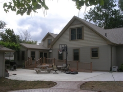 Rear of house with deck, ramp, and patio