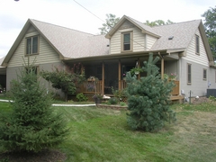 Front of house with addition to left